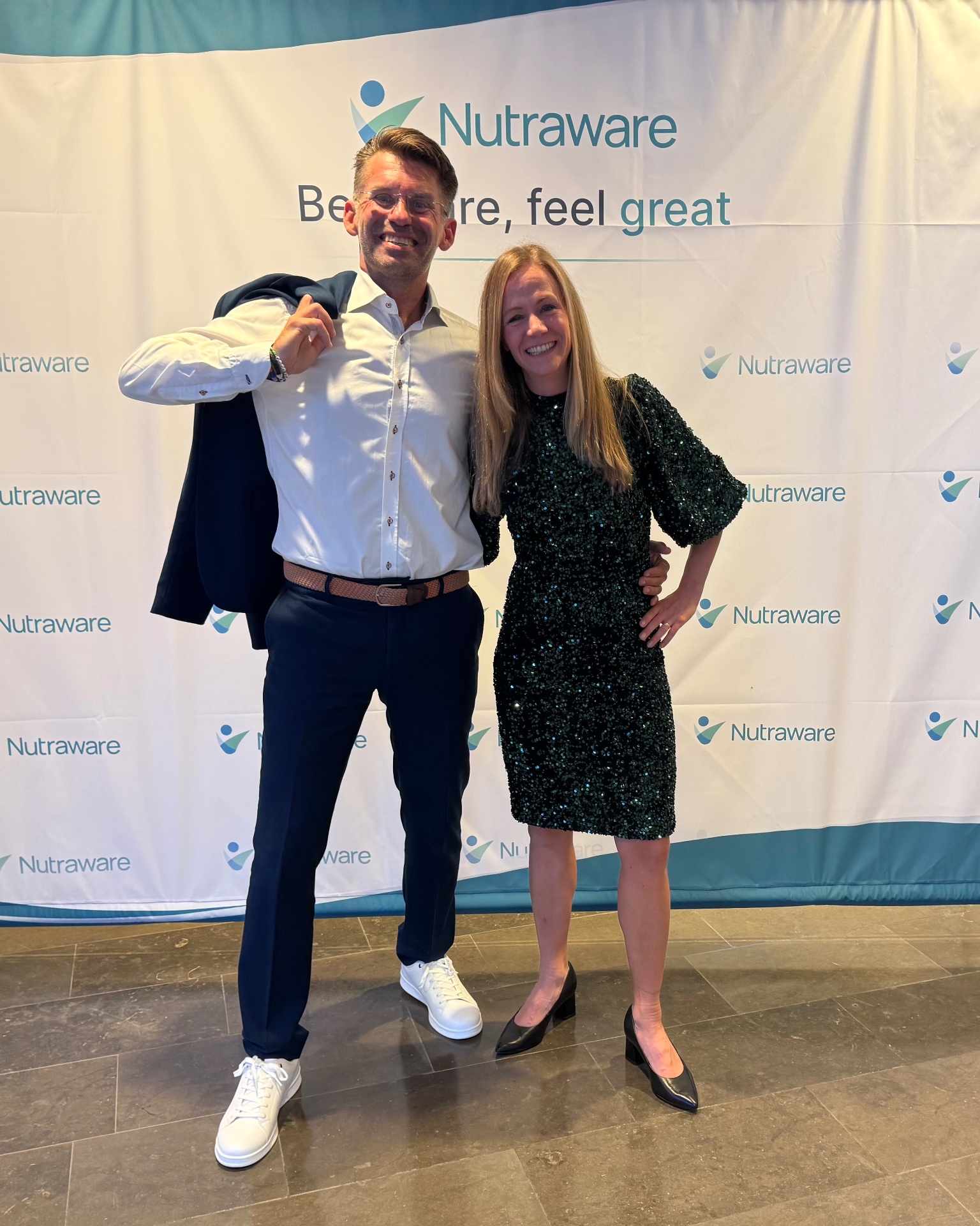 Petra Kindlund and David Blomquist in front of the Nutraware backdrop
